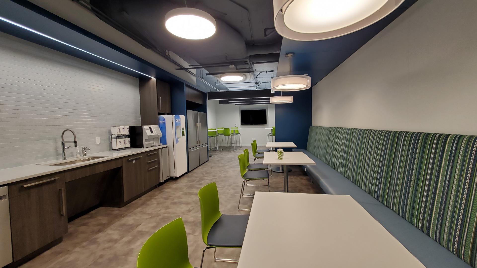 Pantry and lunch area with banquette seating also functions as collaborative teaming area.
